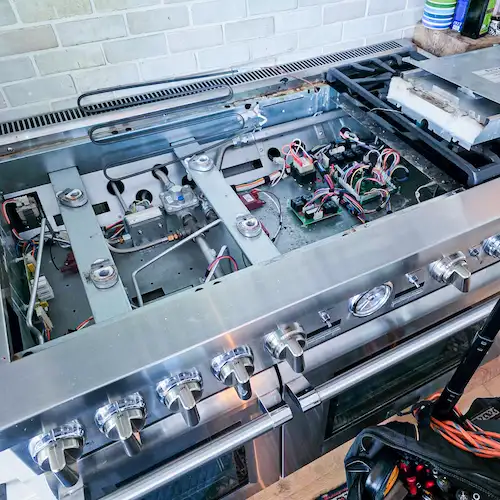 Bertazzoni appliance repair technician servicing a luxury Bertazzoni range in Los Angeles