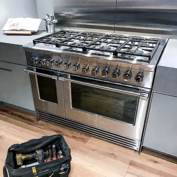 Fisher and Paykel appliance repair technician servicing a premium kitchen appliance in Los Angeles