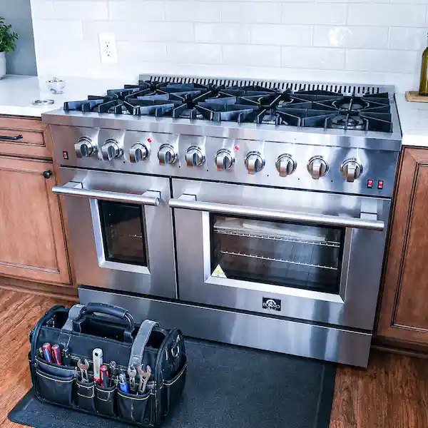 Forno appliance repair technician servicing a pro-style Forno kitchen appliance in Los Angeles